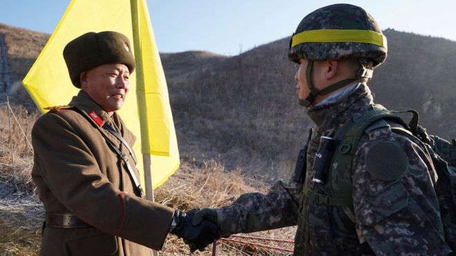 North and South Korea soldiers cross DMZ in peace