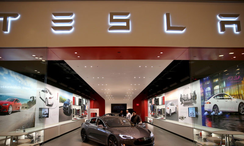 Tesla shares rise after company reverses decision to close all stores
