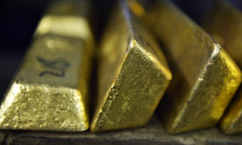 Gold prices fall, with strength in the dollar pulling prices below $1,700