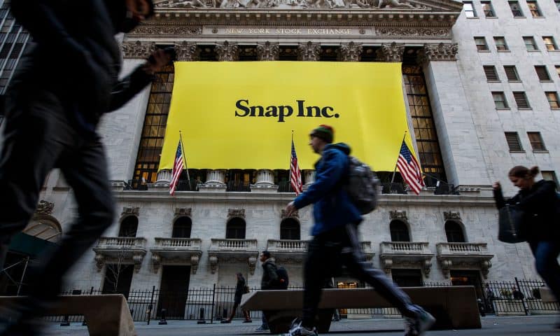 Snap stock drops in late trading as losses grow, but sales and users continue to increase