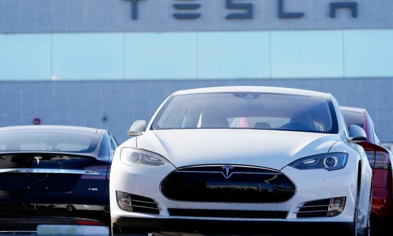 High-Flying Tesla Stock Takes a Hit on 1st Day in S&P 500
