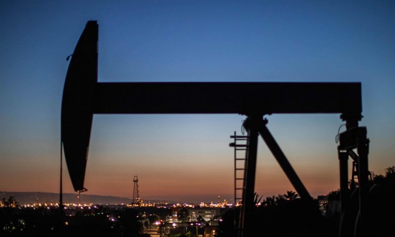 Oil ends higher, with U.S. prices back above $70 a barrel
