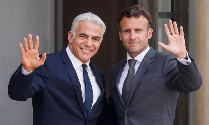 Israel’s Lapid Meets Macron in Paris on First Trip as PM