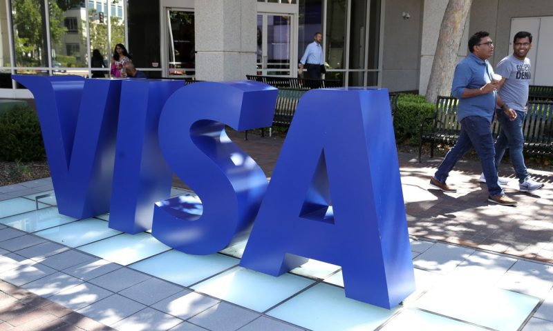 Visa beats on earnings and boosts dividend by 20%
