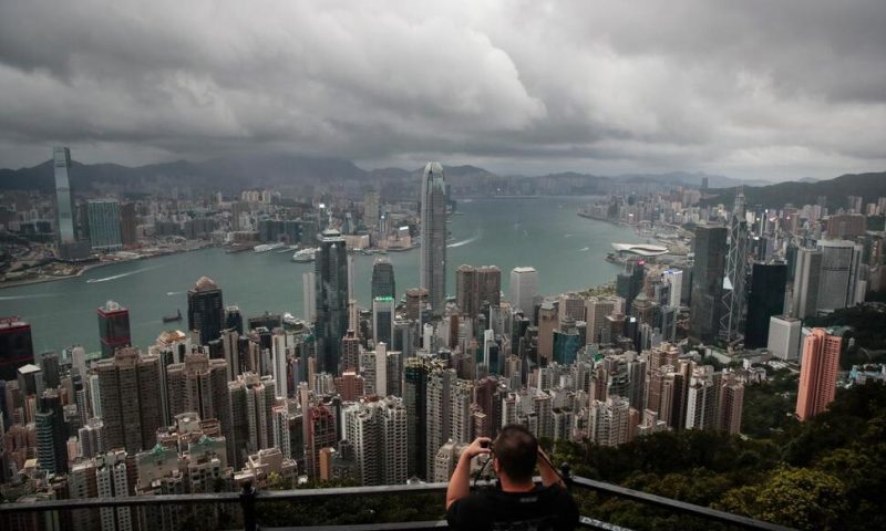 Cyclone, Absences Threaten to Dull Hong Kong Finance Meeting