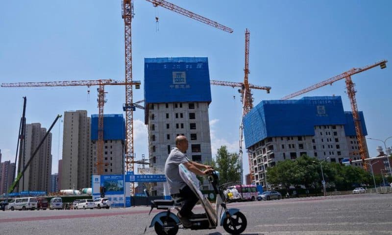 China Pledges More Help for Its Ailing Property Market, as IMF Forecasts Economy Will Slow