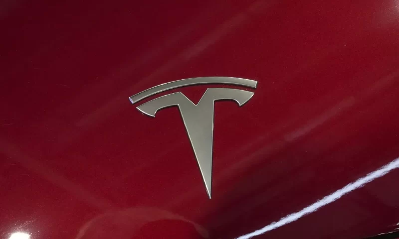 Tesla (NASDAQ:TSLA) Stock Price Down 1.8% – Should You Sell?