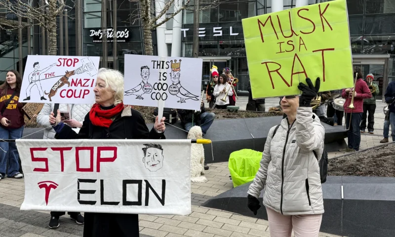 Anti-DOGE protests at Tesla stores target Elon Musk’s bottom line